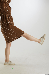 Aera  1 brown dots dress casual dressed flexing leg…